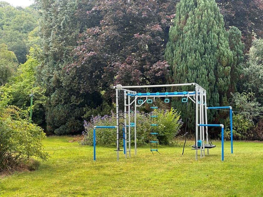 Climbing frame in the garden. Please note children must be supervised at all times | Duvale Priory - Duvale Cottages, Bampton, near Tiverton