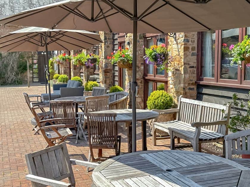 Sitting-out-area | Duvale Barn - Duvale Cottages, Bampton, near Tiverton