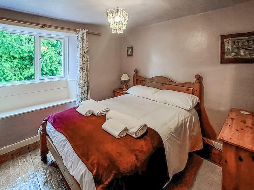 Lavender bedroom with pine double bed. | Brockhill House, Beaminster