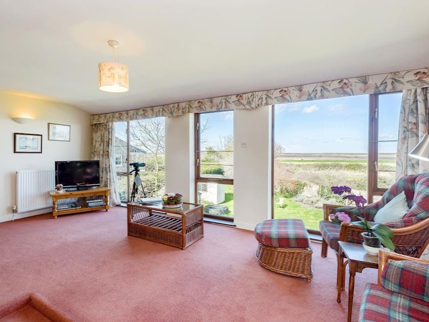 Attractive and spacious living room with picture windows overlooking the salt-marshes | Seagulls, Blakeney