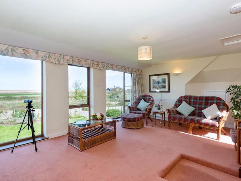 Living room with enjoys far-reaching, spectacular views across the Blakeney salt-marshes | Seagulls, Blakeney