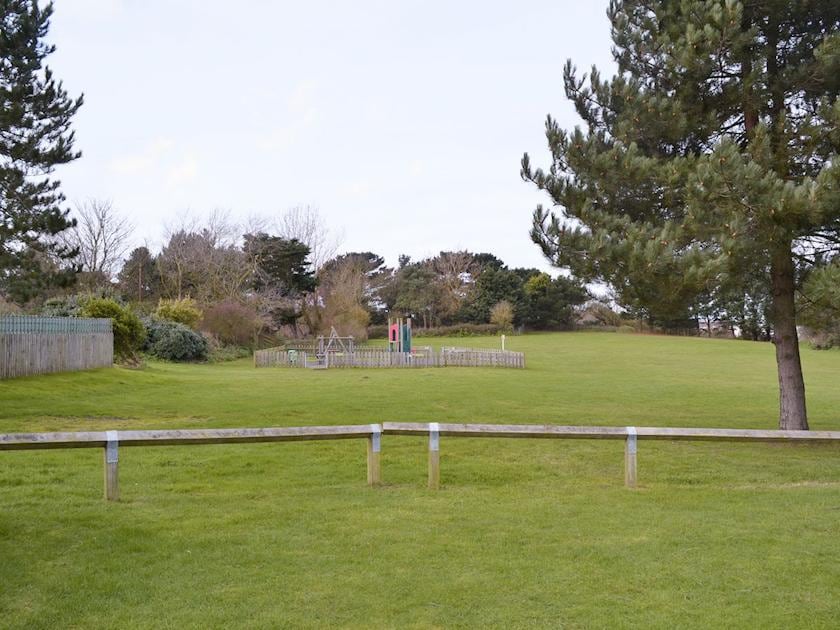 Open grassed area and children’s play facility | Seacroft, East Runton, near Cromer