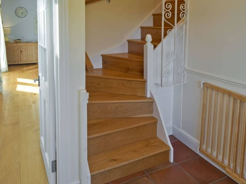 Stairway with child safety gate | Granary Cottage, Tattingstone, near Ipswich