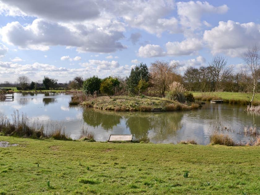 Recreation is provided by the extensive grounds and well-stocked fishing lake | Apartment 1 - Glebe Farm Apartments and Lodge, West Barkwith, near Market Rasen