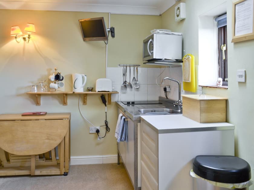 Compact kitchen in open plan living area | Apartment 2 - Glebe Farm Apartments and Lodge, West Barkwith, near Market Rasen
