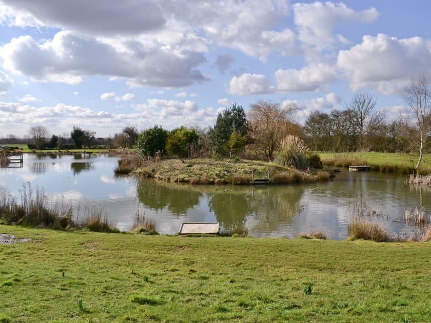 Recreation is provided by the extensive grounds and well-stocked fishing lake | Apartment 2 - Glebe Farm Apartments and Lodge, West Barkwith, near Market Rasen
