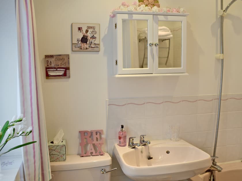 Quirky bathroom with shower over bath and WC | Lace Cottage, Ashbourne