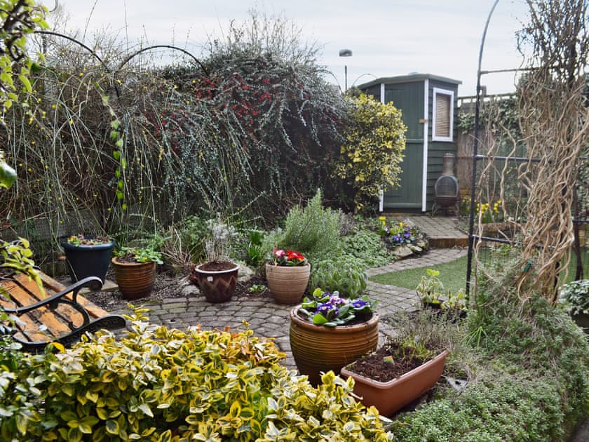 Small enclosed garden with patio and furniture | Lace Cottage, Ashbourne