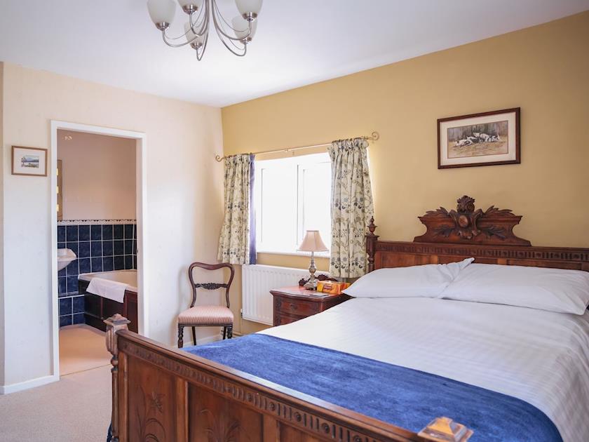 Double bedroom has the benefit of an en-suite bathroom | Farmhouse Wing - Millmoor Farm, Bickley, near Malpas 