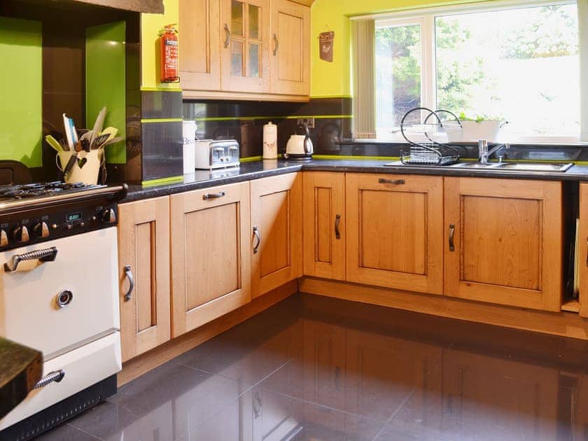The kitchen is very well equipped with a range cooker with gas hob and electric fan ovens | Carreg Y Garth Isaf, Rhiwlas near Bangor