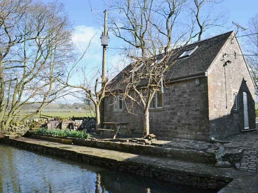 A stone built annexe by the riverside | The Old Mill Annexe, near Hartington