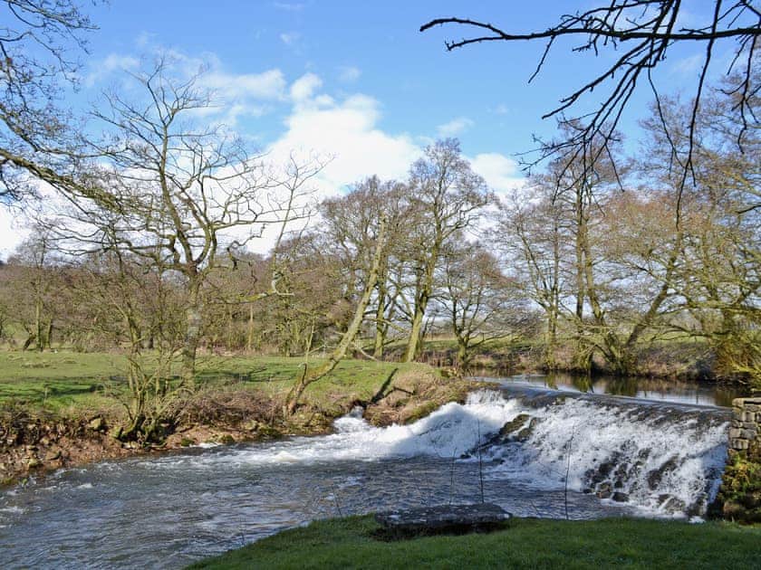 Riverside setting and surrounding Peak District countryside | The Old Mill Annexe, near Hartington