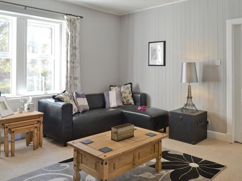 Stylish seating area in lounge | The Retreat - Beaufort Cottages, Kiltarlity, near Beauly