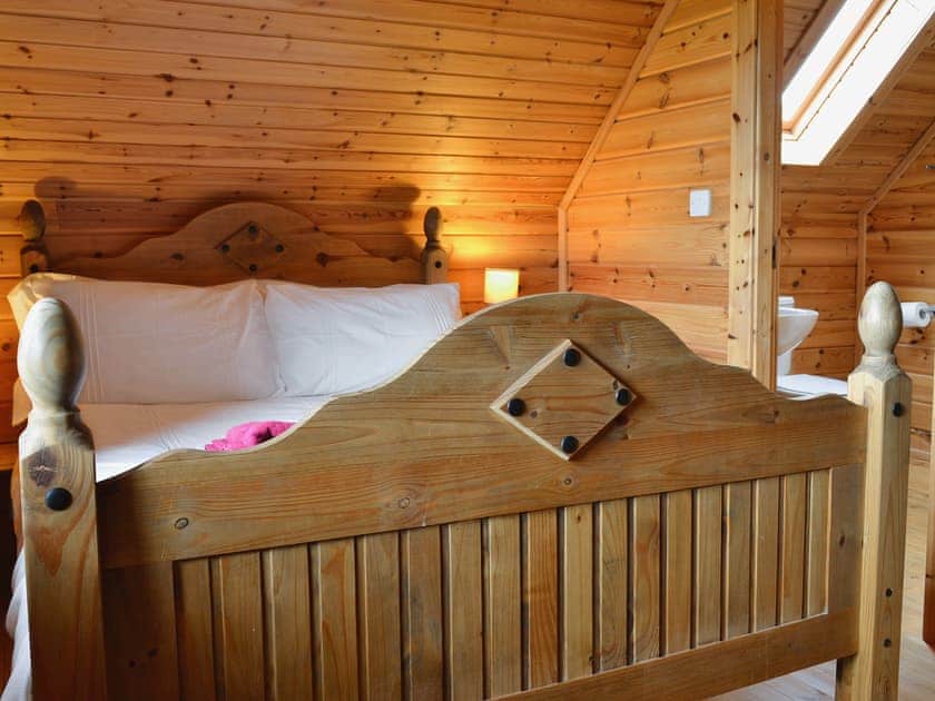 Double bedroom with french doors and en-suite shower room | Sun Rise Lodge No. 10, Llanbedr