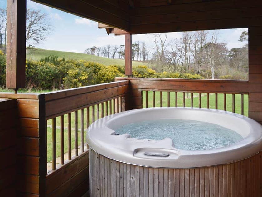 Hot tub on the balcony | Sun Rise Lodge No. 10, Llanbedr