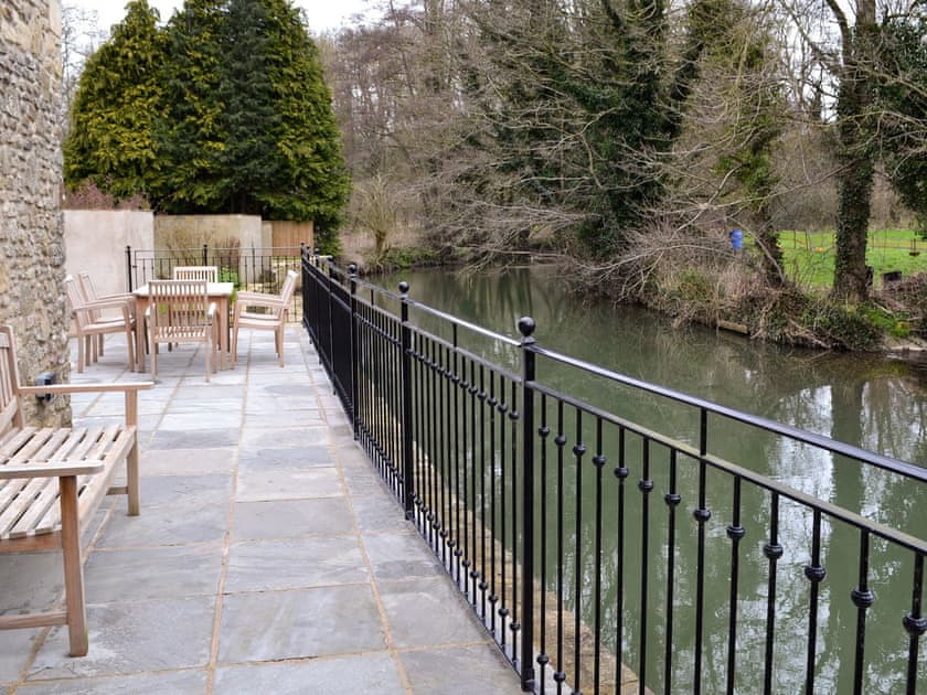 Terrace overlooking river | Herons’ Weir - Jeffries Mill Cottages, Spring Gardens, Frome