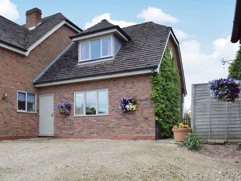 Private entrance to the totally self-contained cottage | Sunrise, Kings Coughton, near Alcester