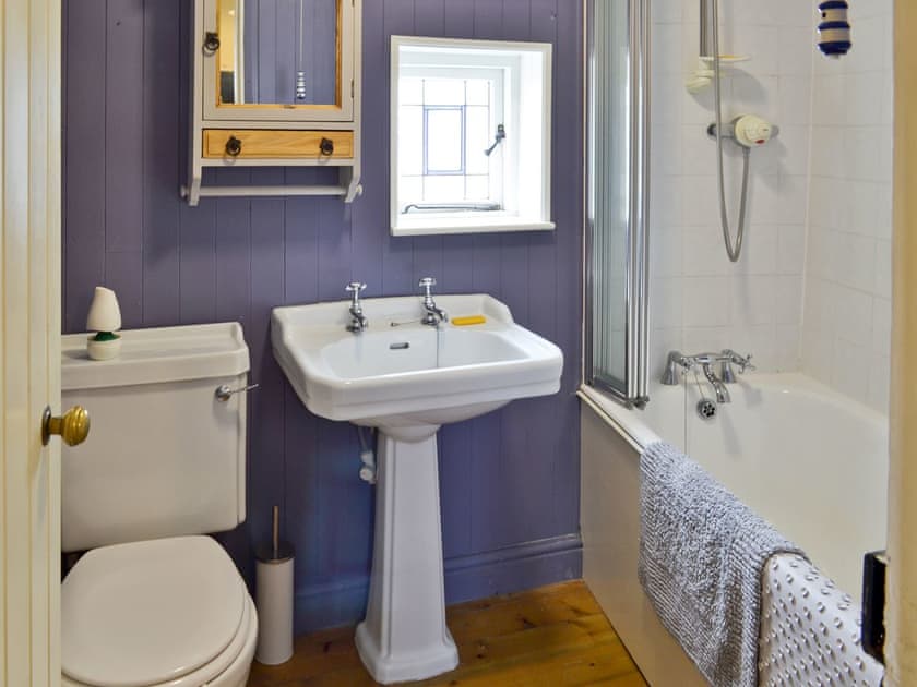 Family bathroom with shower over bath | Ocean Cottage, Whitby