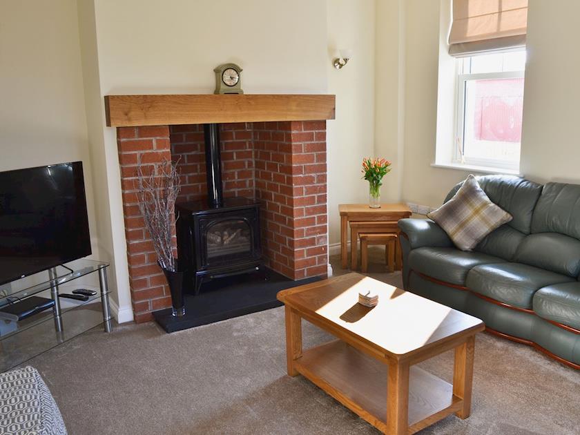 Living room with gas woodburner | Birchfield, Rhuallt, near St Asaph