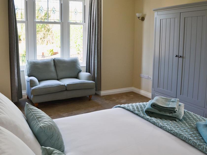 Double bedroom with 5ft bed, TV and seating area | Birchfield, Rhuallt, near St Asaph