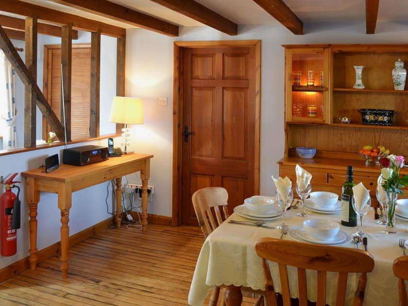 Open plan kitchen/dining space provides a social space in which to enjoy a family meal | Coachmans Cottage, White Cross, near Newquay