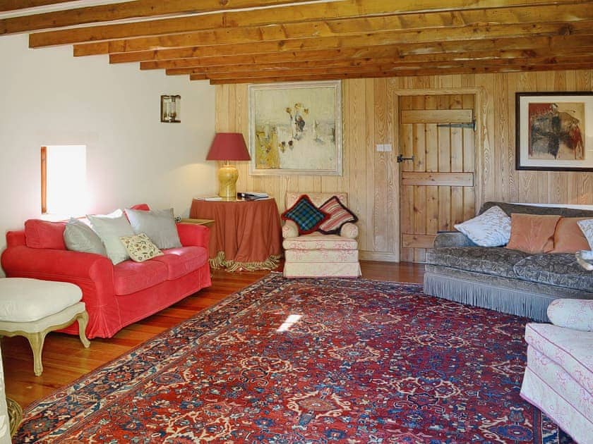 The grand living room has exposed beams and opulent furnishings | Arkland Mill - Crofts Cottages, Near Castle Douglas