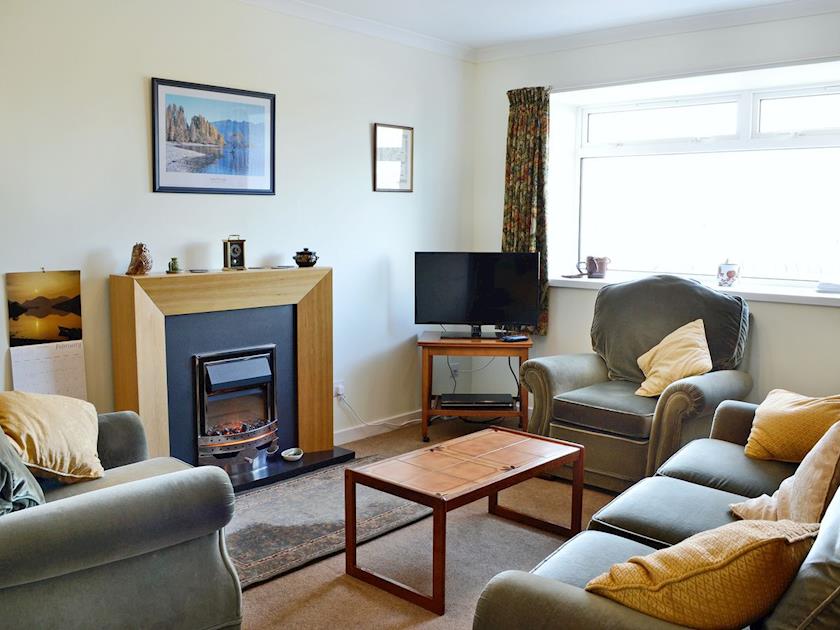 Cosy living room with electric coal-effect fire | Baravullin, Benderloch near Oban