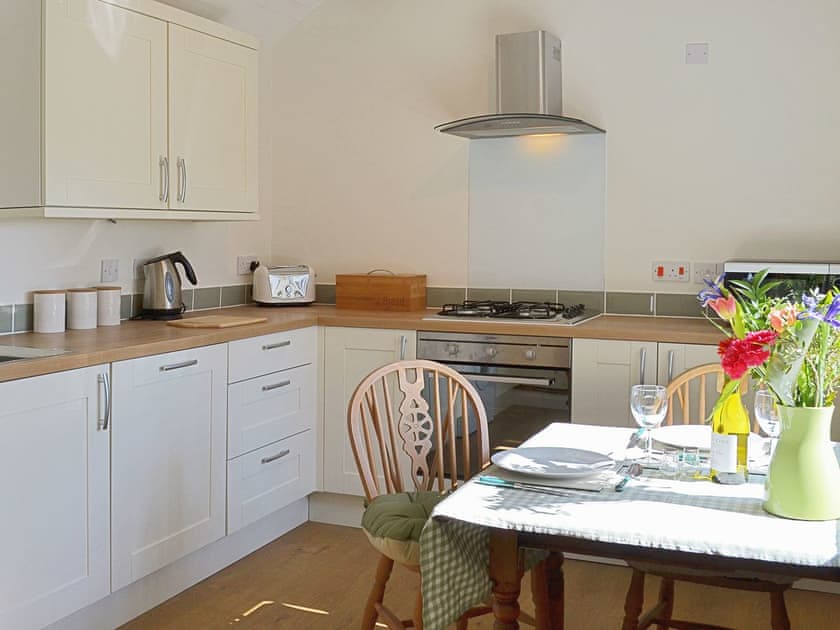 A bright and airy kitchen/diner makes a great place to take meals | Garden Cottage, Ugborough, near Ivybridge