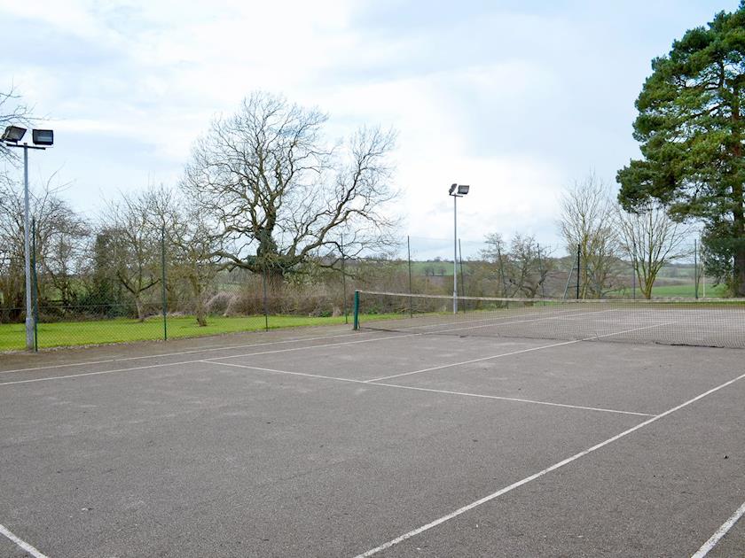 Shared flood-lit all weather surface tennis court | Somersal Farmhouse, Somersal Herbert, Ashbourne
