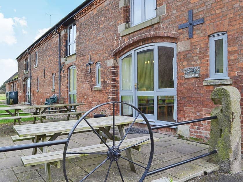 There is a spacious outdoor eating area with a barbecue | The Granary, Somersal Herbert, Ashbourne