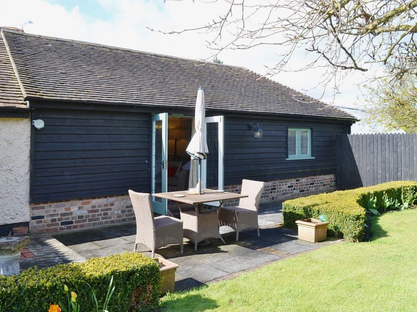 The patio makes a great place for sitting out in the fresh air | The Stables - Canterbury Cottages, Shatterling, near Canterbury 