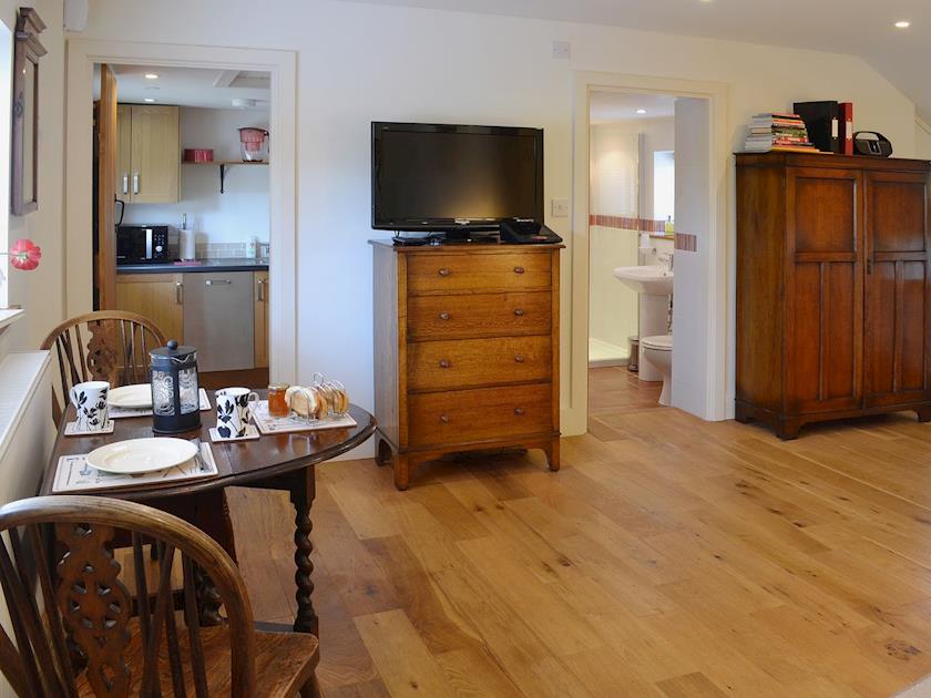 The stylish living/dining room has an oak floor | The Gardener’s Cottage - Canterbury Cottages, Shatterling, near Canterbury
