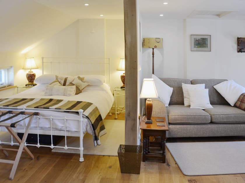 The light and airy bedroom is adjacent to the living area | The Gardener’s Cottage - Canterbury Cottages, Shatterling, near Canterbury