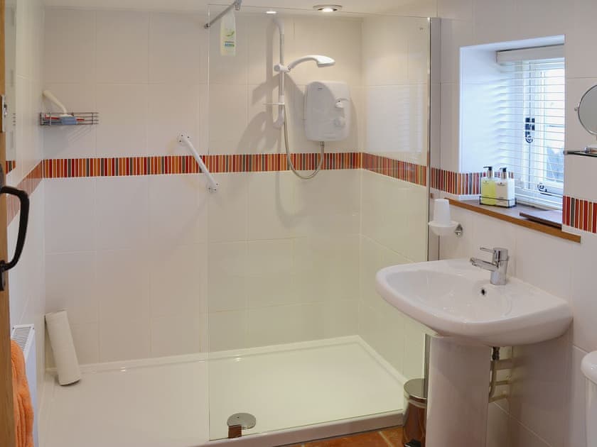 The fully-tiled shower room has a large walk in shower | The Gardener’s Cottage - Canterbury Cottages, Shatterling, near Canterbury
