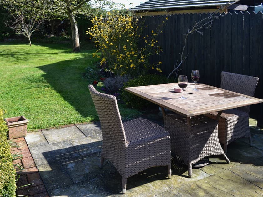 The patio is an ideal spot to have an outdoor meal or relax with a glass of wine | The Gardener’s Cottage - Canterbury Cottages, Shatterling, near Canterbury