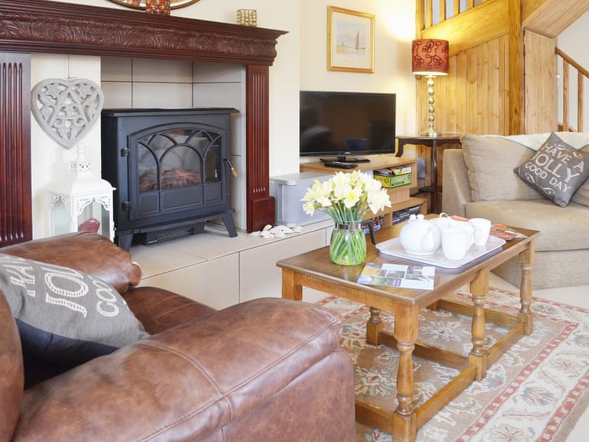 Comfortable furnishings make afternoon tea in front of the fire a pleasure | Yr Wyddfa - The Old School, Caeathro, Caernarfon