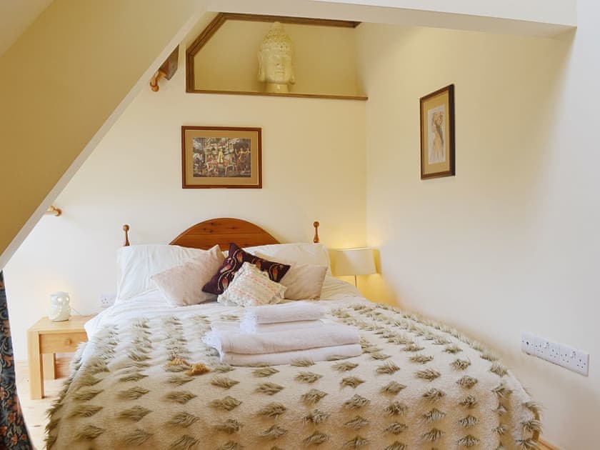 Gorgeous soft furnishings and contemporary decor give the double bedroom a romantic feel | Yr Wyddfa - The Old School, Caeathro, Caernarfon