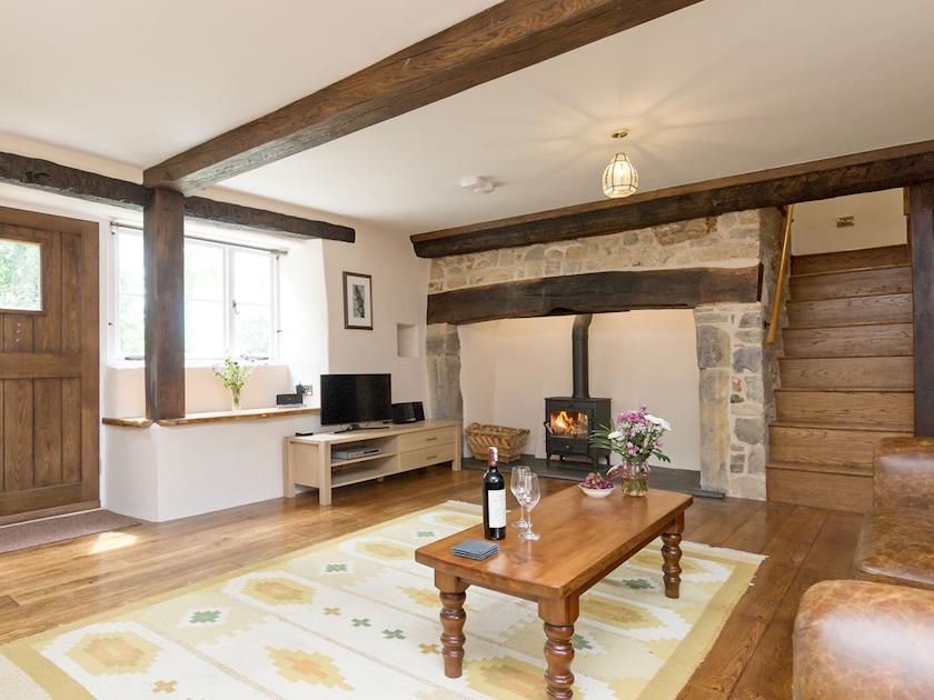 Spacious, beamed living room with inglenook fireplace | The Farmhouse at Higher Westwater Farm, Axminster