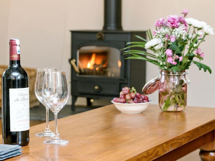 Cosy and inviting living room with wood burner | The Farmhouse at Higher Westwater Farm, Axminster