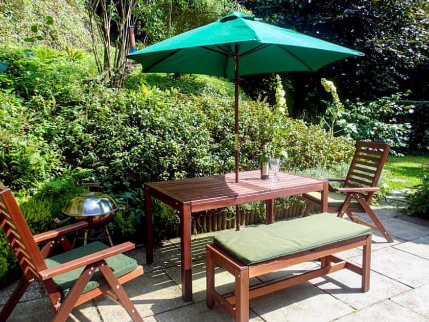 Spacious patio with seating furniture | Heale Cottage, Littleham, near Bideford