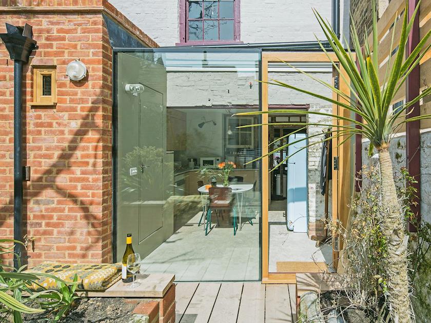 Courtyard with sitting-out area & furniture | Smugglers Cottage, Margate
