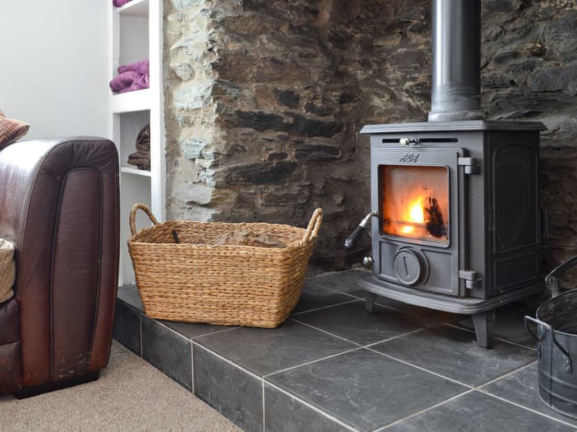 Wood-burner in heritage fireplace | Penteryfn, near Holyhead, Isle of Anglesey