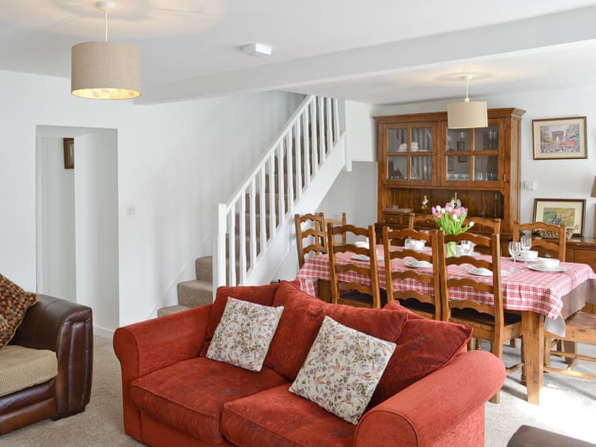 Dining area and stairs to upper level in living room | Penteryfn, near Holyhead, Isle of Anglesey