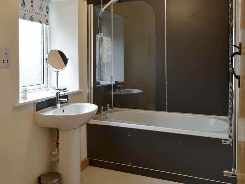 Family bathroom with shower over bath | Curlew Cottage, Belford, near Bamburgh