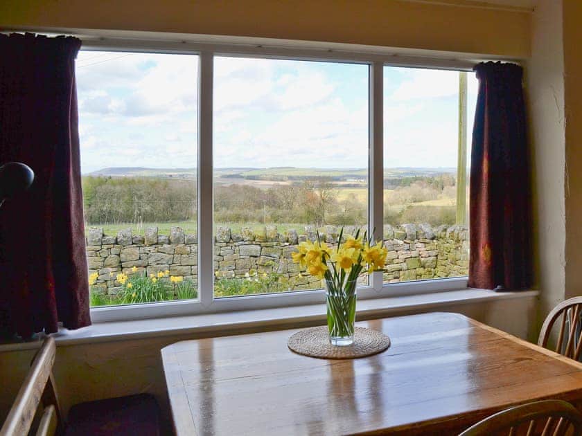 The dining area is well situated, perfect for looking out across farmland whilst you have your meal | Garden Cottage, Edlingham, near Alnwick