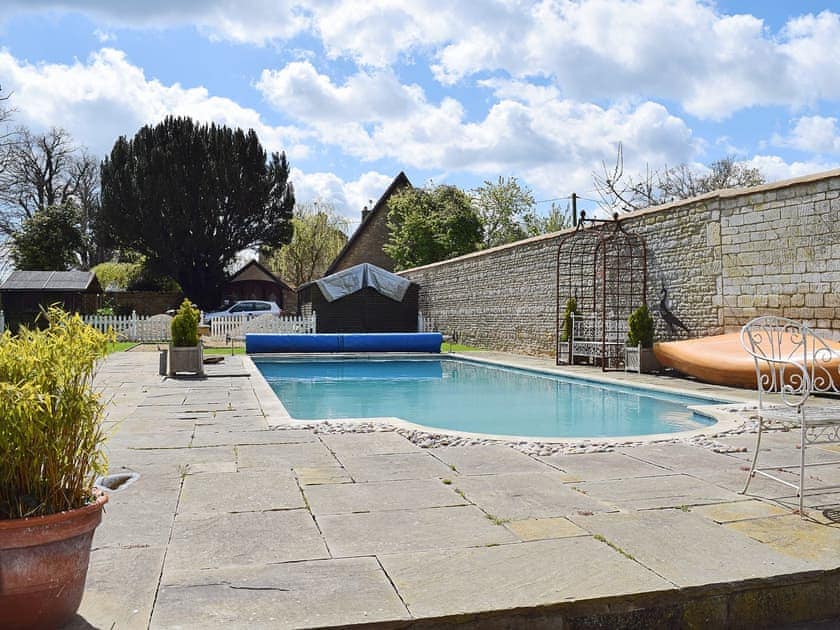 Shared outdoor swimming pool | River Nene Cottages, Water Newton, near Peterborough