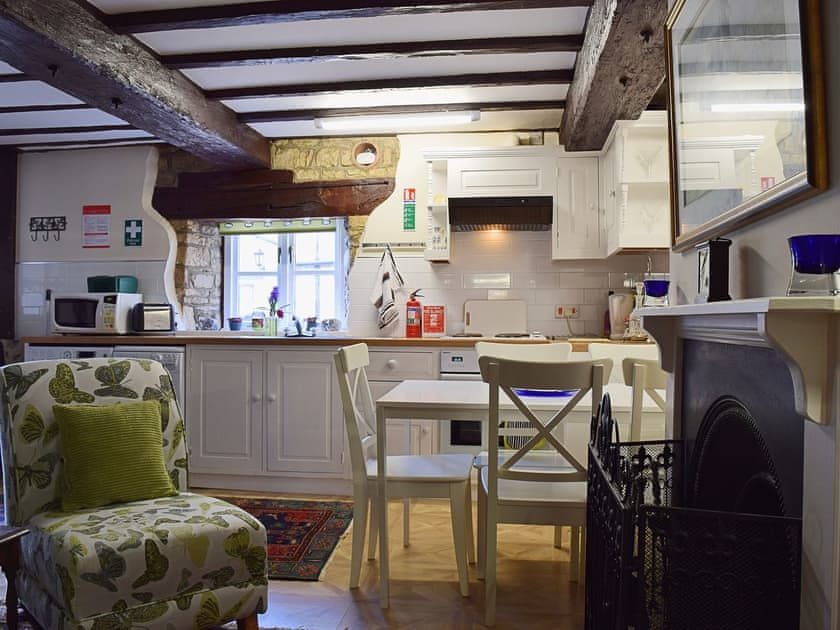 There is amodest dining area in the open plan living space | Yew Tree Cottage - River Nene Cottages, Water Newton, near Peterborough