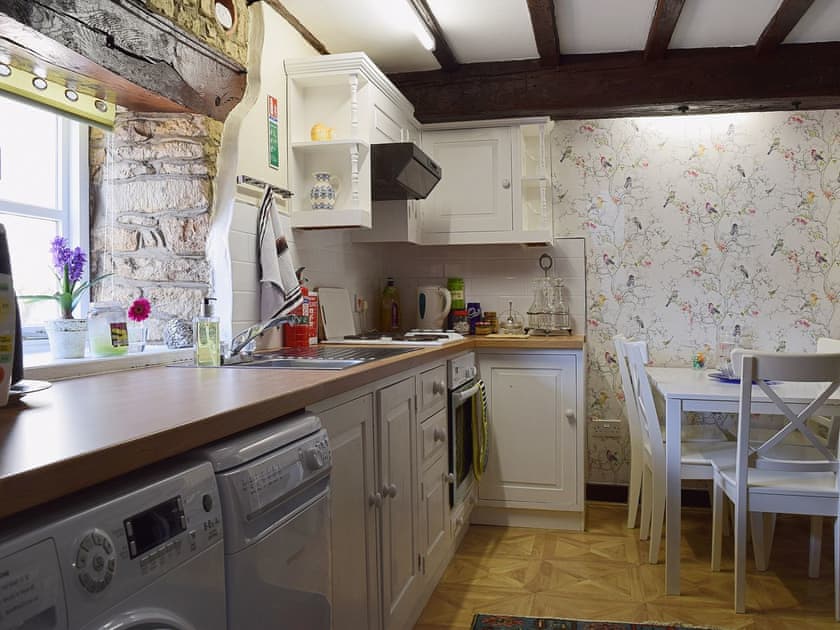 The galley style kitchen makes great use of the space | Yew Tree Cottage - River Nene Cottages, Water Newton, near Peterborough