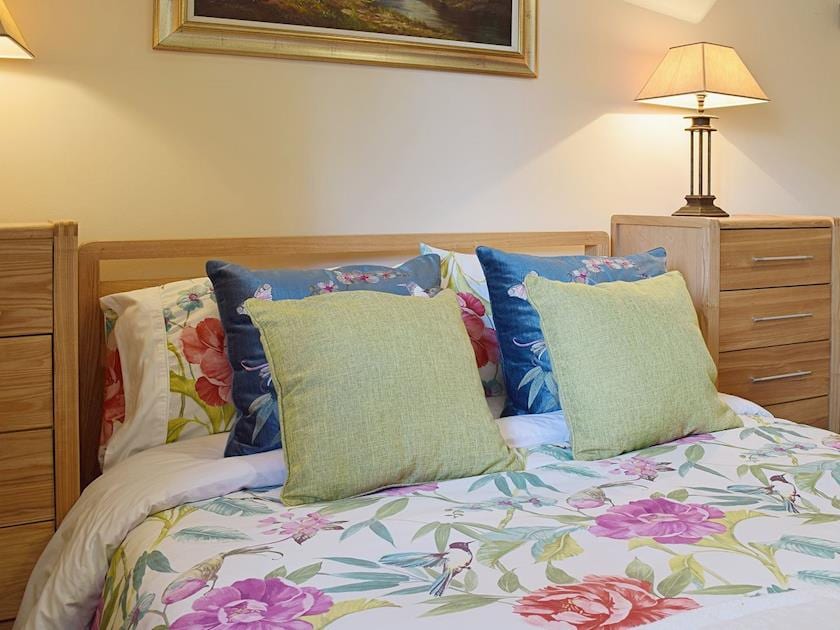 The double bedroom is cosy and romantic | Yew Tree Cottage - River Nene Cottages, Water Newton, near Peterborough