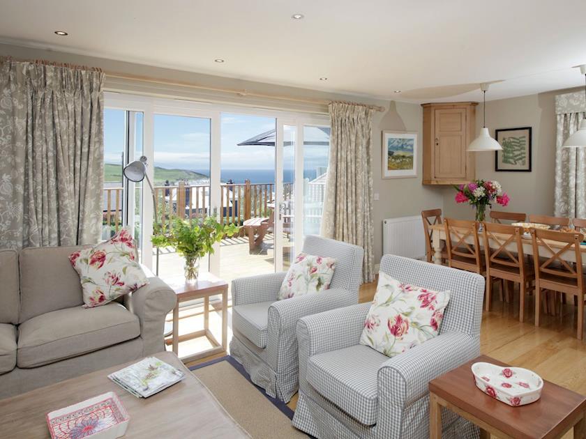 Spacious living area with patio doors to raised terrace | Cedar Lodge, Portpatrick